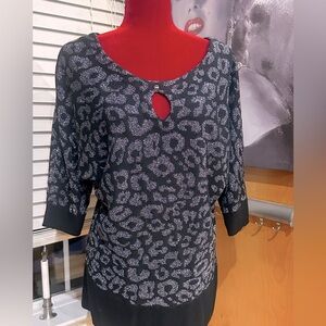 Black and Silver Leopard Print Top
Size Large